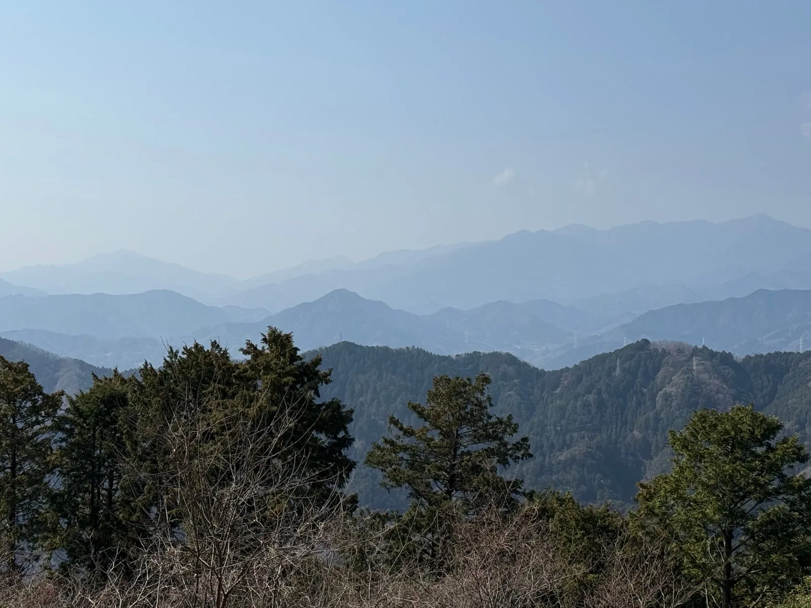 Layered blue ridgelines in spring haze, seen from Mt. Takao