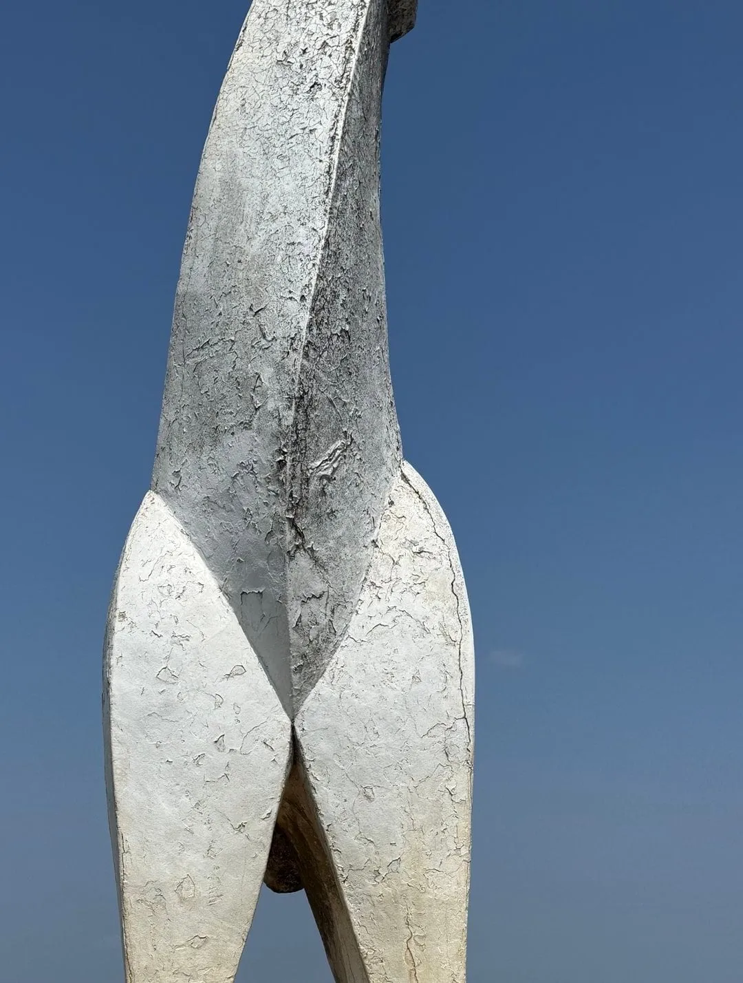 The white horse statue on the summit of Mt. Jinba against a deep blue sky